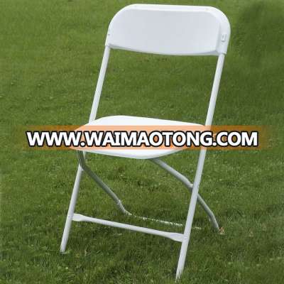 white plastic folding chair for outdoor event rental